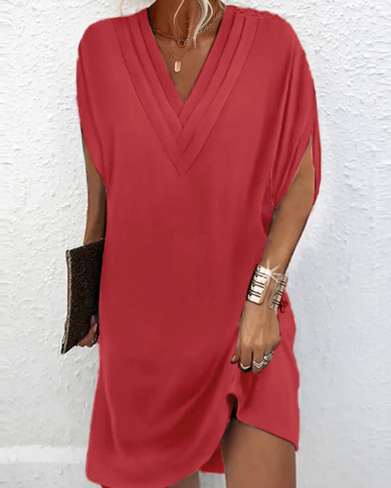 Elegant dress with plain-coloured split sleeves